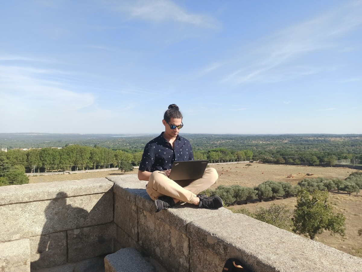 a male digital nomad working in a remote area